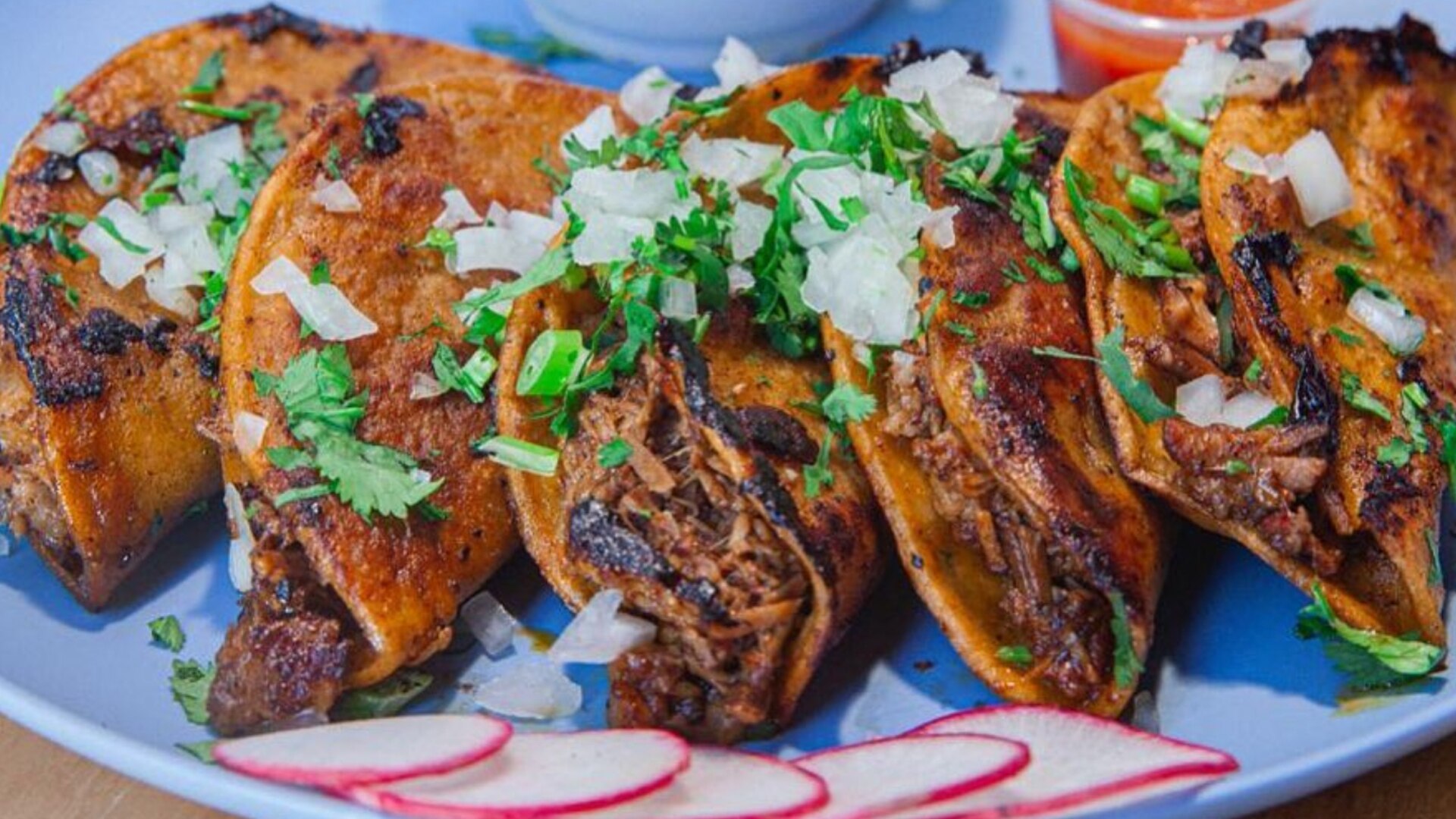 Authentic Mexican street food at Taqueria El Primo, featuring birria.